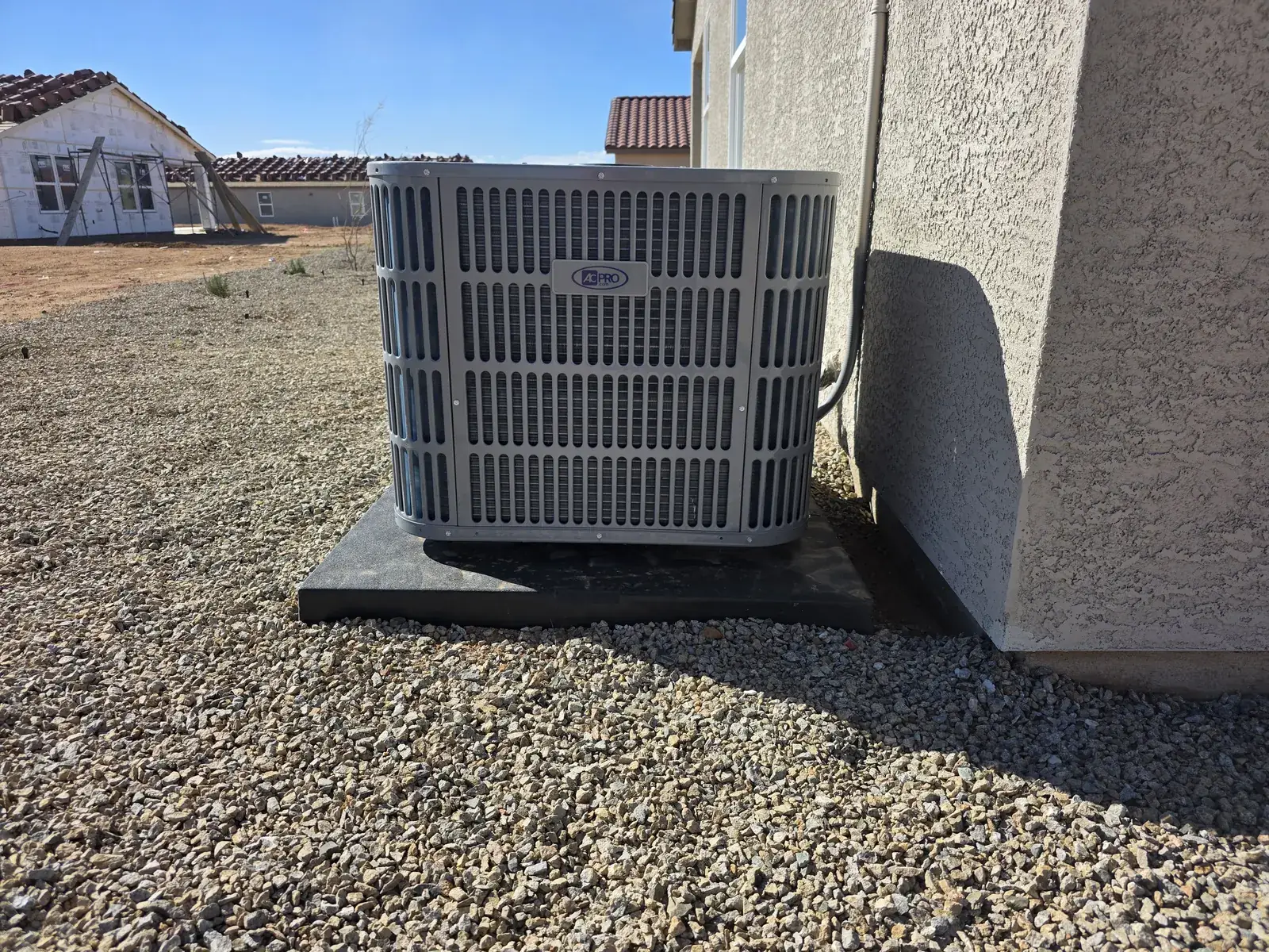 Condensing unit installed at a home exterior