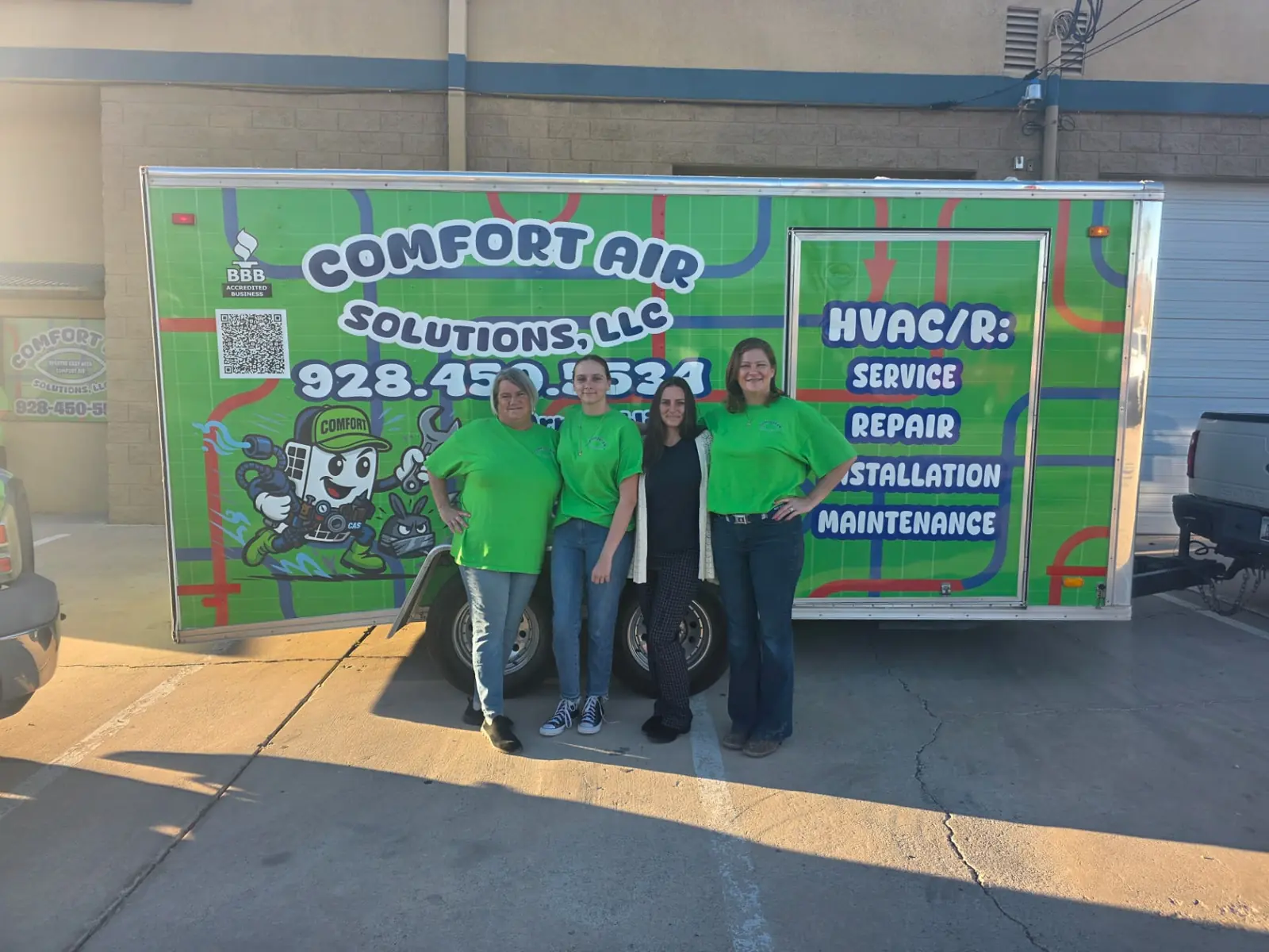 Comfort Air Solutions office and support team standing in front of the company trailer