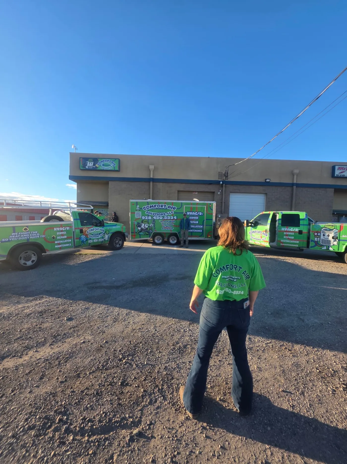 Comfort Air Solutions trucks and trailer parked outside the company shop