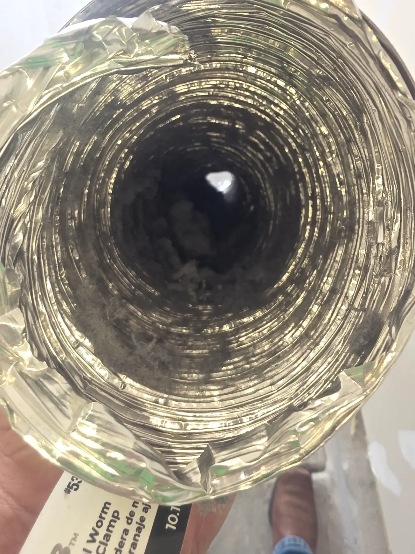 Lint buildup inside a foil dryer vent duct