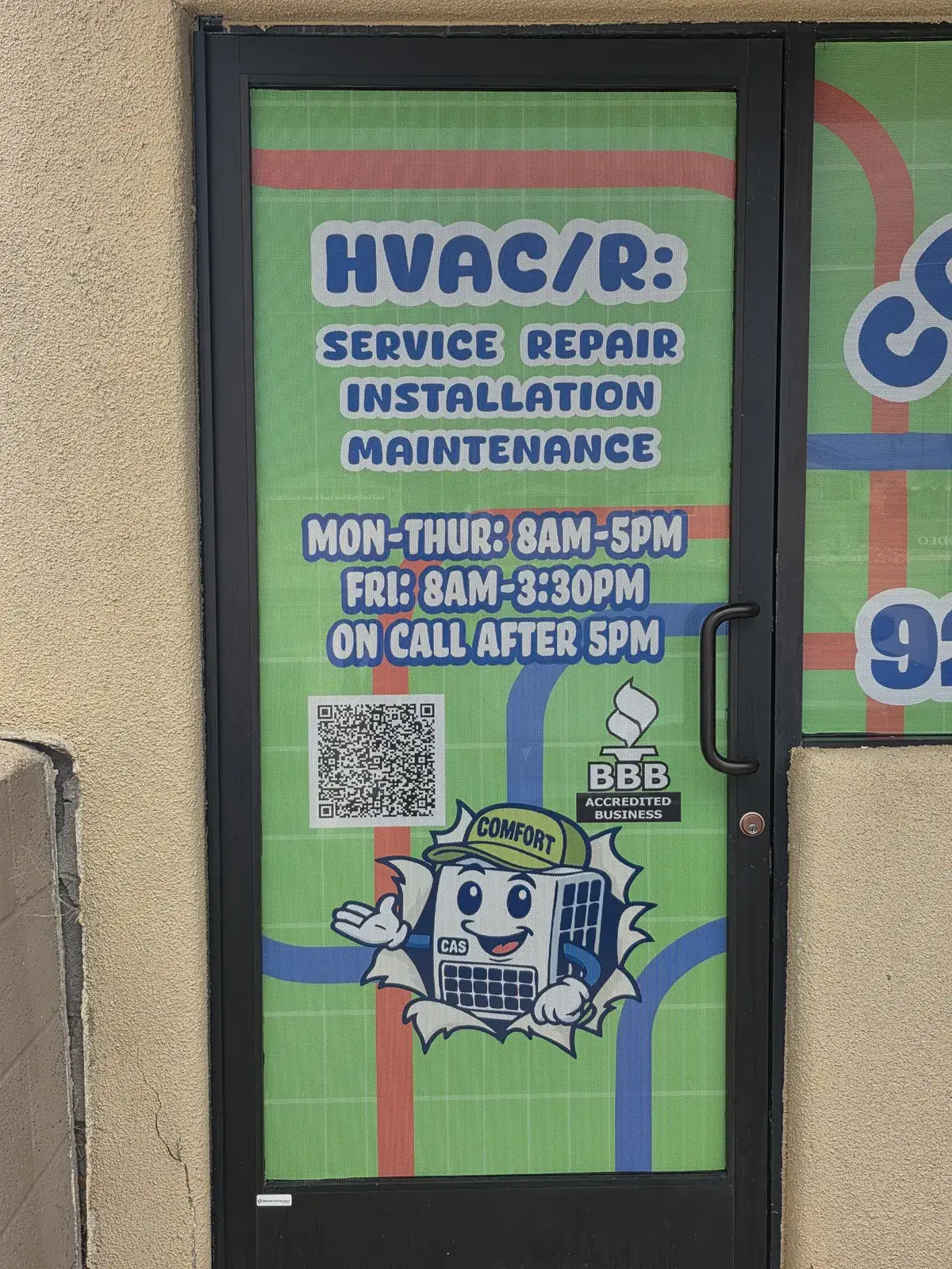 Comfort Air Solutions shop door showing service, repair, installation and maintenance hours