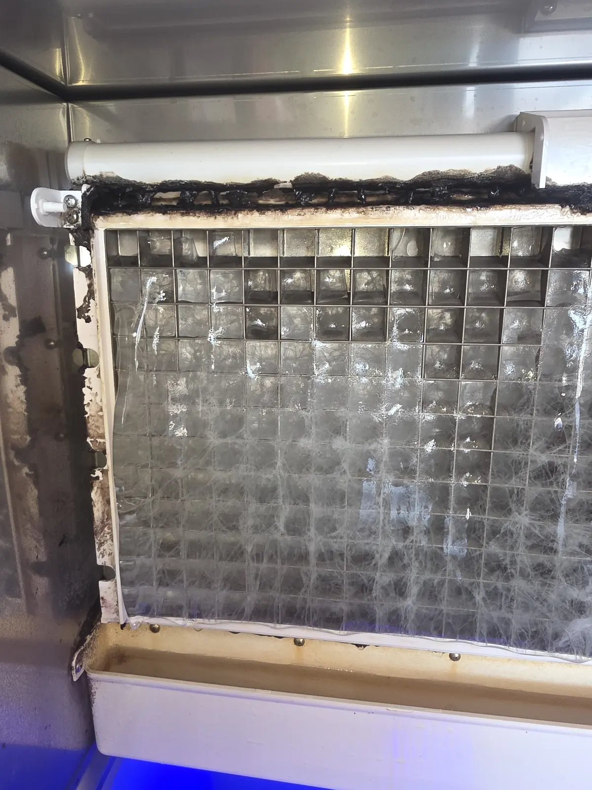 Before cleaning: mineral scale on an ice machine evaporator