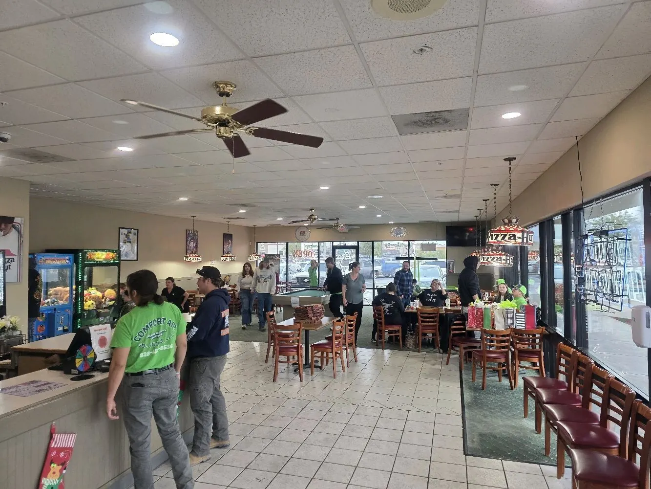 Comfort Air Solutions technicians working on commercial kitchen equipment