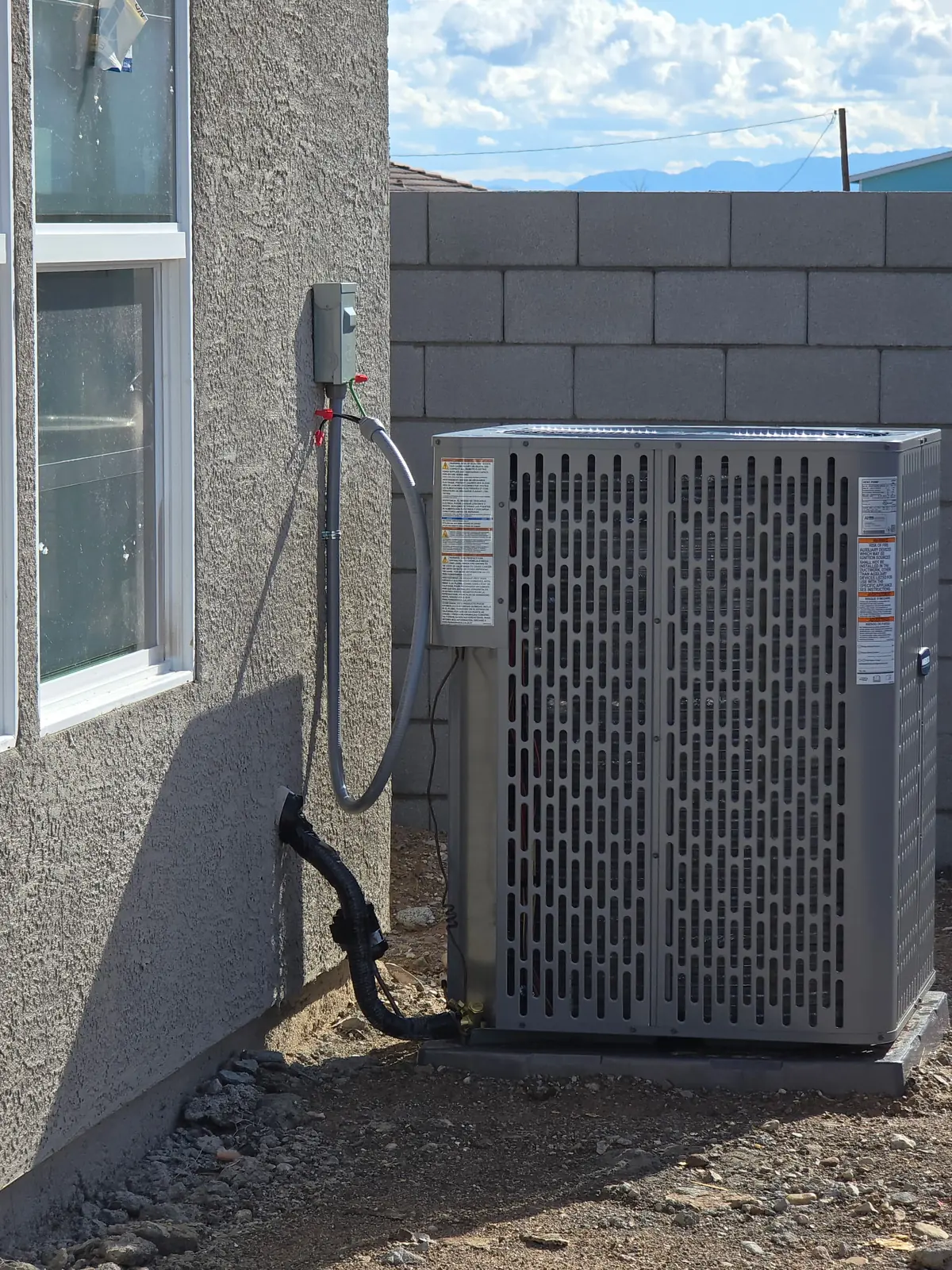 New outdoor unit set on a pad