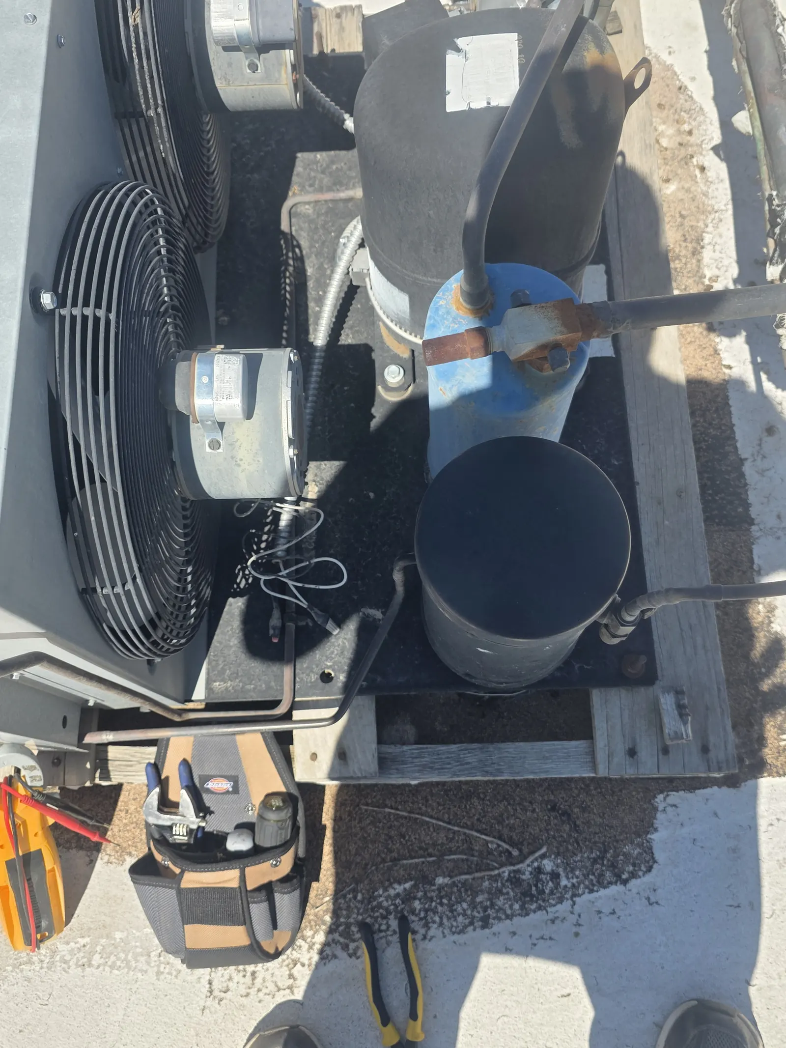 Open condensing unit with tools set out during service