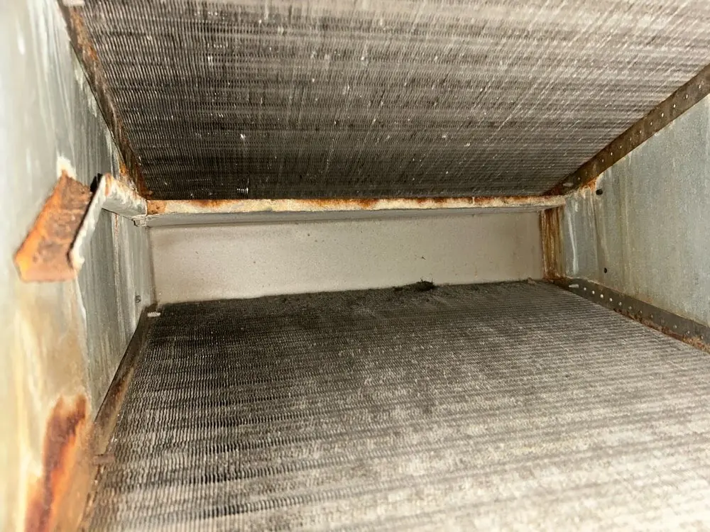 Dust buildup inside an air handler cabinet
