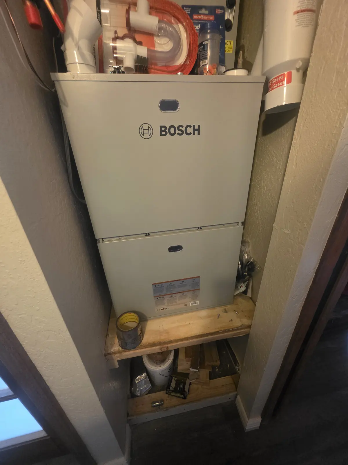 Bosch gas furnace installed in a hallway closet