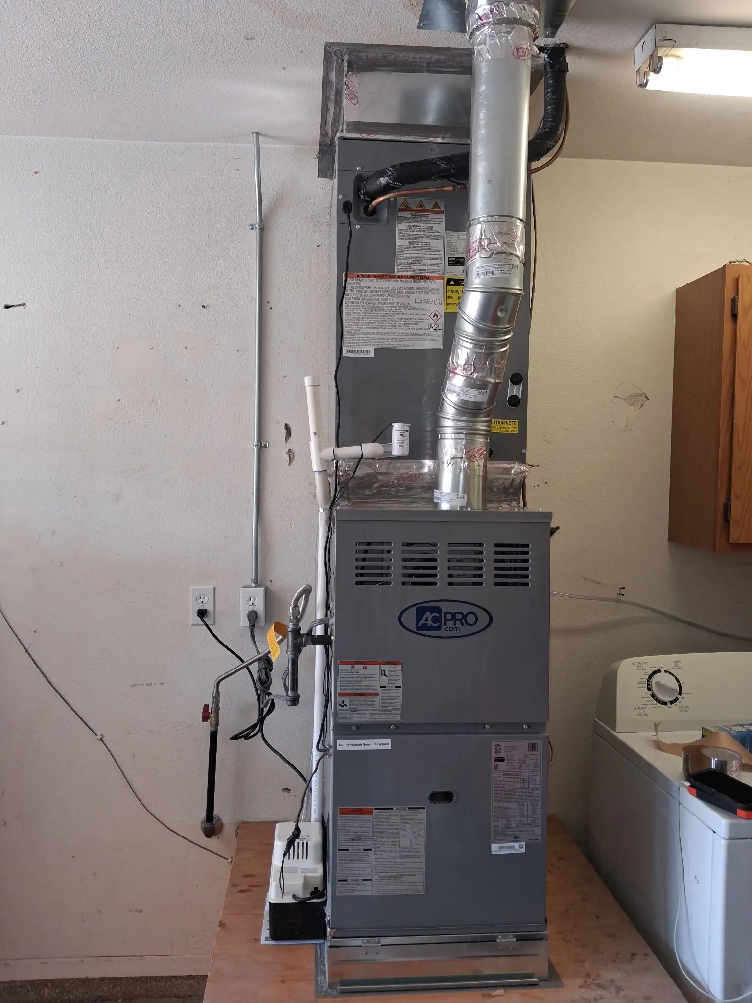 Gas furnace installed in a garage utility space