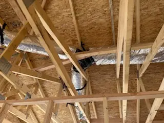 Duct trunk and branch runs above framing
